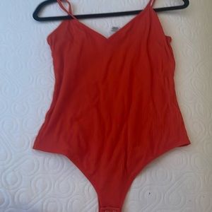 Orange body suit